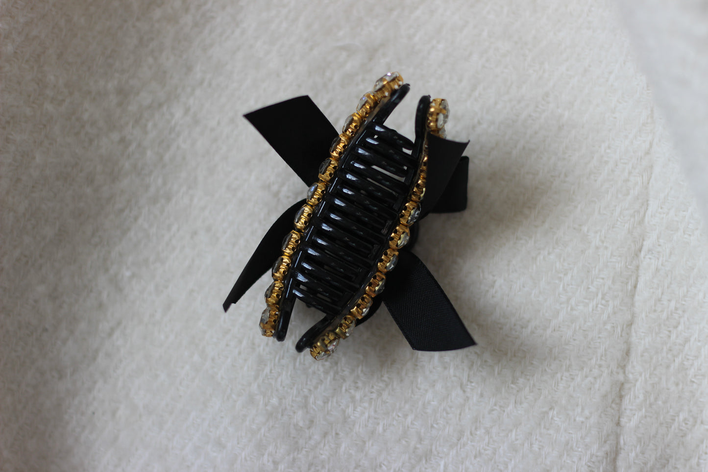 The Crystal Bow Mini Claw Clip in Black